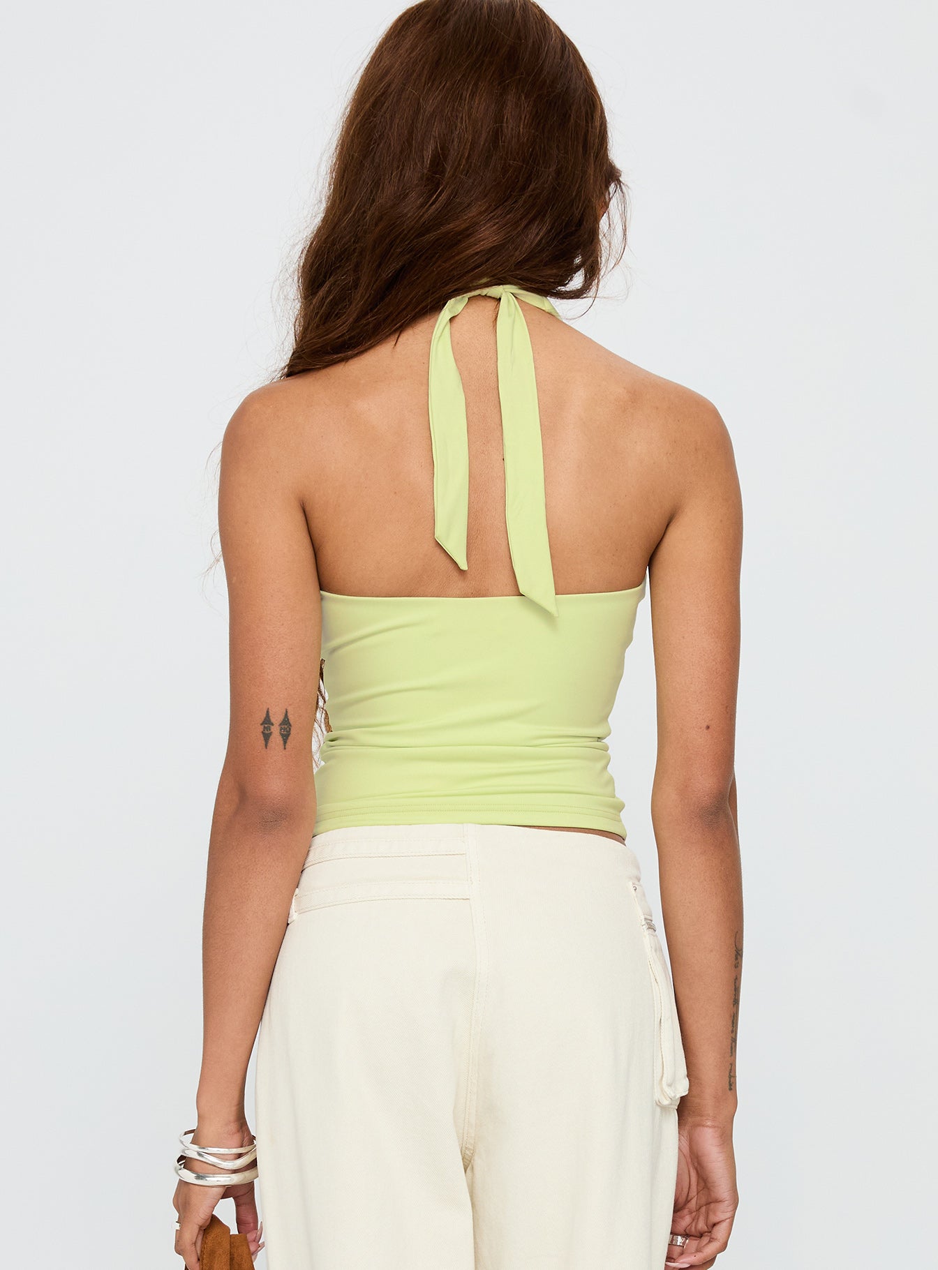 back view of model wearing Princess Polly Assumptions Halter Top Sage Sleeveless Square Neck 