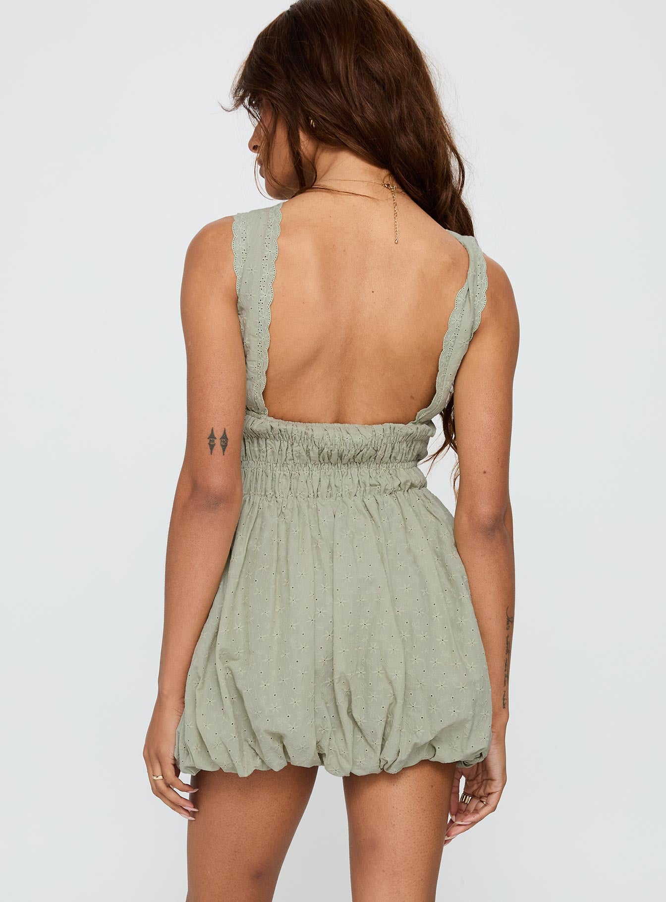 back view of model wearing Princess Polly Vittoria Bubble Hem Mini Dress Sage High Neck 