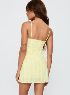 back view of model wearing Princess Polly I Know Places Mini Dress Lemon Scoop Neck 