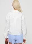 back view of model wearing Princess Polly Rinon Long Sleeve Top White Full Sleeves V-Neck 