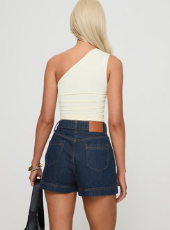 back view of model wearing Princess Polly Heuston Denim Skort Dark Wash High Waisted Shorts 
