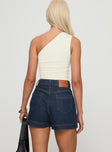 back view of model wearing Princess Polly Heuston Denim Skort Dark Wash Lower Impact High Waisted Shorts 