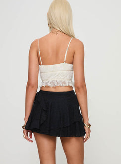 back view of model wearing Princess Polly Talin Mini Skirt Black Mini Skirts 