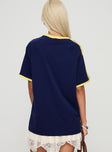 back view of model wearing Princess Polly Spectate Tee Navy Half Sleeves V-Neck 