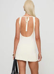 back view of model wearing Princess Polly Mayok Mini Dress Cream Tall High Neck 