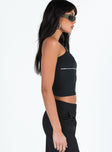 Front view of model wearing  front Princess Polly Short Sleeves Asymmetric Neckline  Zippity Tank Top Black