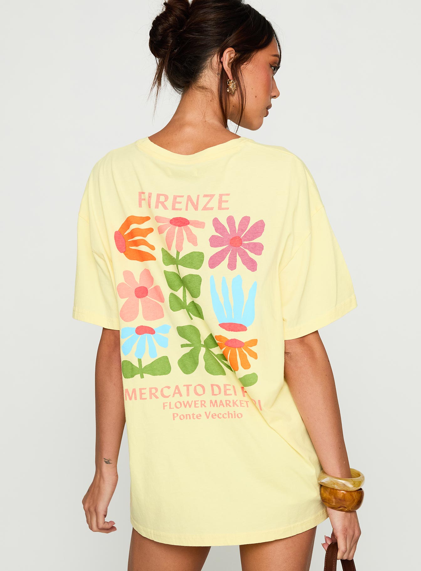 side view of model wearing Princess Polly Firenze Flower Market Graphic Top Yellow Half Sleeves Crew Neck 