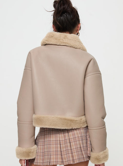 Beige Faux leather jacket Gold toned hardware, zip fastening down front, buckle fastening at neck, twin hip pockets