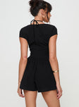 Black Playsuit V neckline, invisible zip fastening at back, pleats at waist, cap sleeve