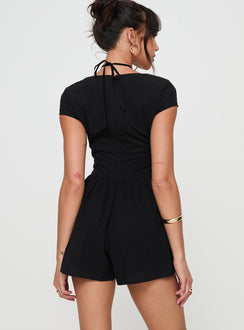 Black Playsuit V neckline, invisible zip fastening at back, pleats at waist, cap sleeve