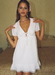 front view of model wearing Princess Polly Penelofie Mini Dress White V-Neck 