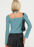 back view of model wearing Princess Polly Chantria Long Sleeve Halter Top Blue Full Sleeves Plunger 