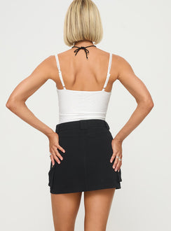 back view of model wearing Princess Polly Lydie Cargo Mini Skirt Black Mini Skirts 