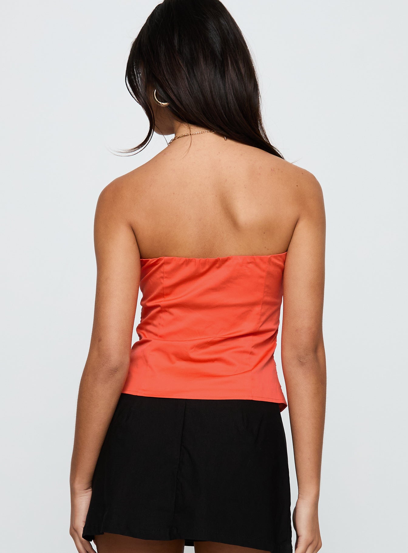 back view of model wearing Princess Polly Diamonds Are Forever Strapless Top Orange Sleeveless Sweetheart 