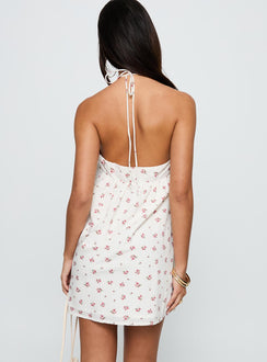 back view of model wearing Princess Polly Moonlit Mini Dress White Floral Asymmetric Neckline 