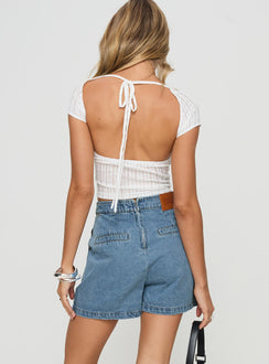 back view of model wearing Princess Polly Bentiez Denim Skort Mid Wash High Waisted Shorts 