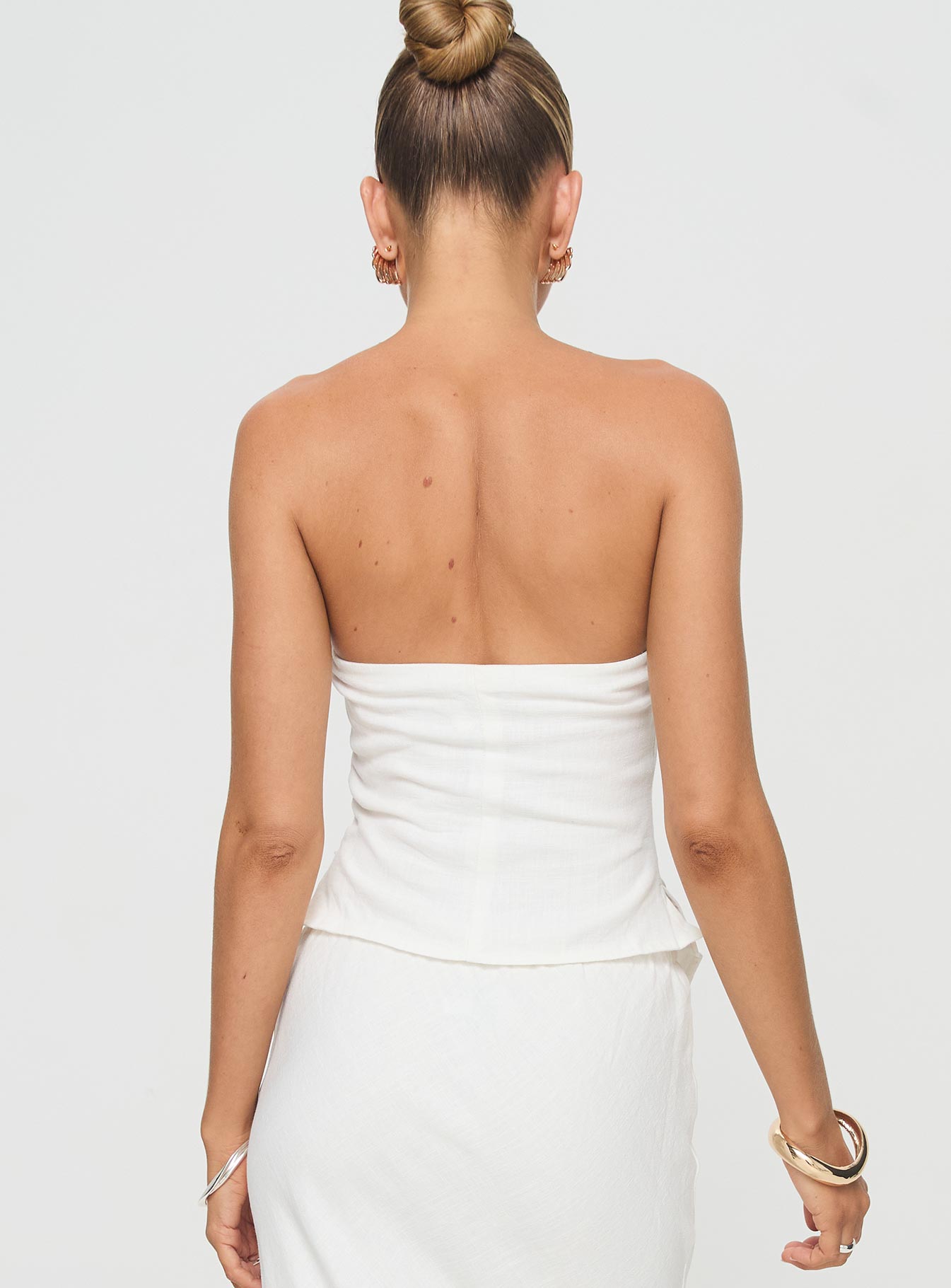 back view of model wearing Princess Polly Birdie Asymmetric Linen Blend Top White Sleeveless straight 