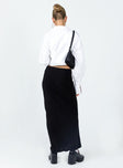 back view of model wearing Princess Polly Jodie Maxi Skirt Black Petite Maxi 