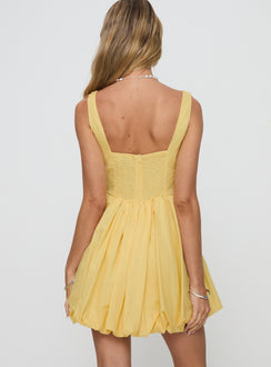 back view of model wearing Princess Polly Alcott Bubble Hem Mini Dress Lemon Square Neck 
