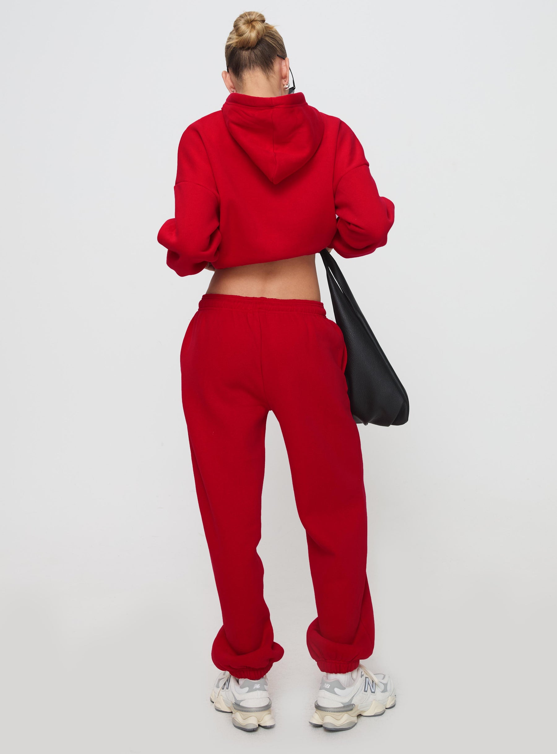 back view of model wearing Princess Polly Dream Fleece Ankle Cuff Sweatpants Red High Waisted Pants 
