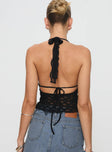 back view of model wearing Princess Polly Only Angel Halter Top Black Sleeveless Scoop Neck 