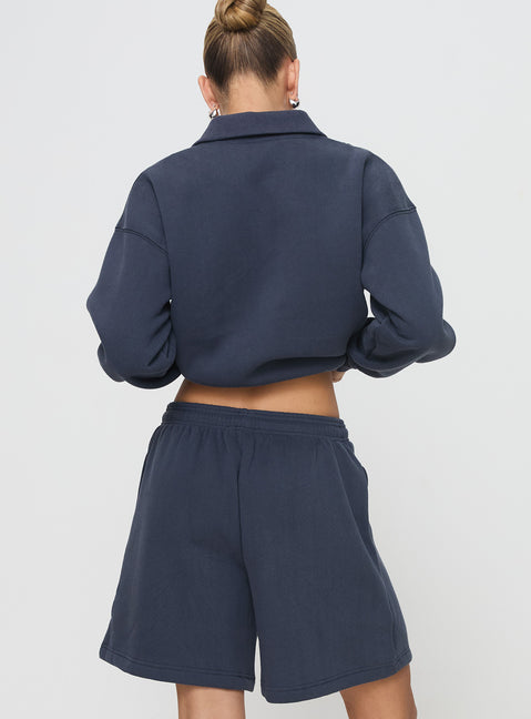 back view of model wearing Princess Polly Dream Fleece Longline Shorts Navy High Waisted Shorts 