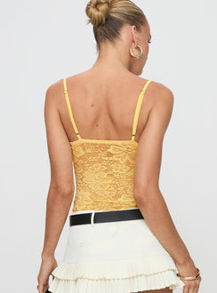 back view of model wearing Princess Polly Manski Lace Top Yellow Sleeveless Plunger 