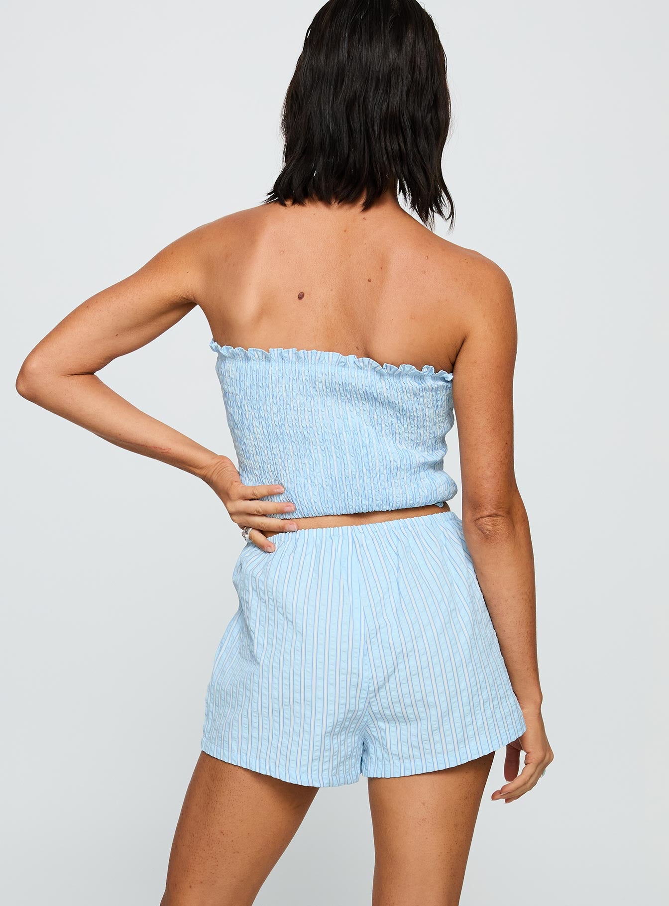 back view of model wearing Princess Polly Saskea Shorts Blue High Waisted Shorts 