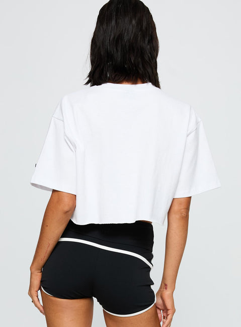 back view of model wearing Princess Polly Nyu Track Tee White Half Sleeves Crew Neck 