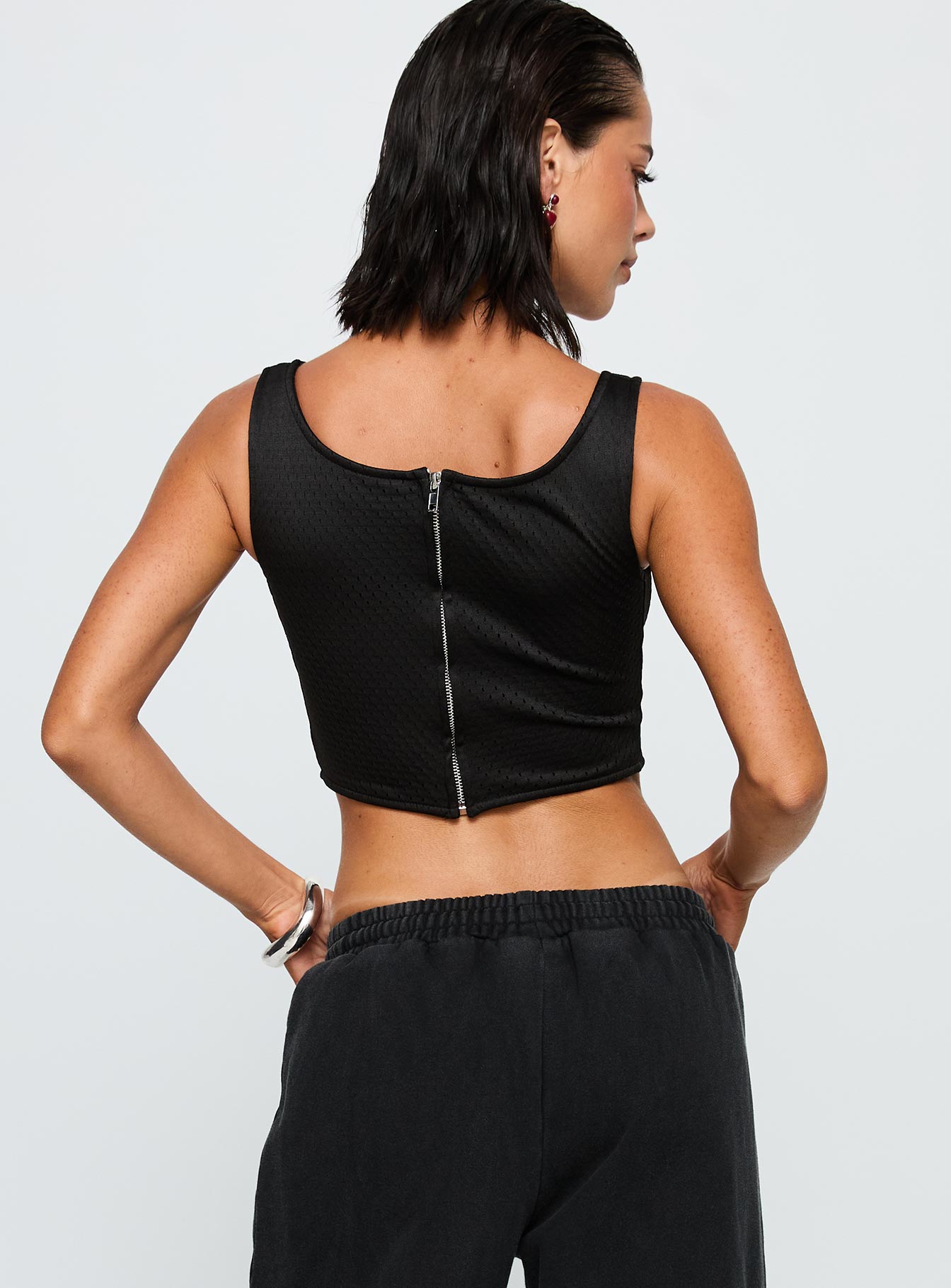 back view of model wearing Princess Polly SDSU Jersey Corset Top Black Sleeveless Square Neck 