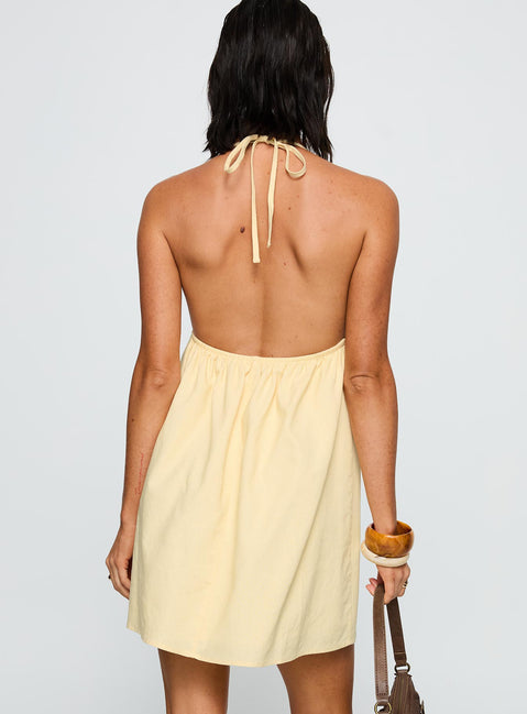 back view of model wearing Princess Polly Melanea Mini Dress Yellow Plunger 