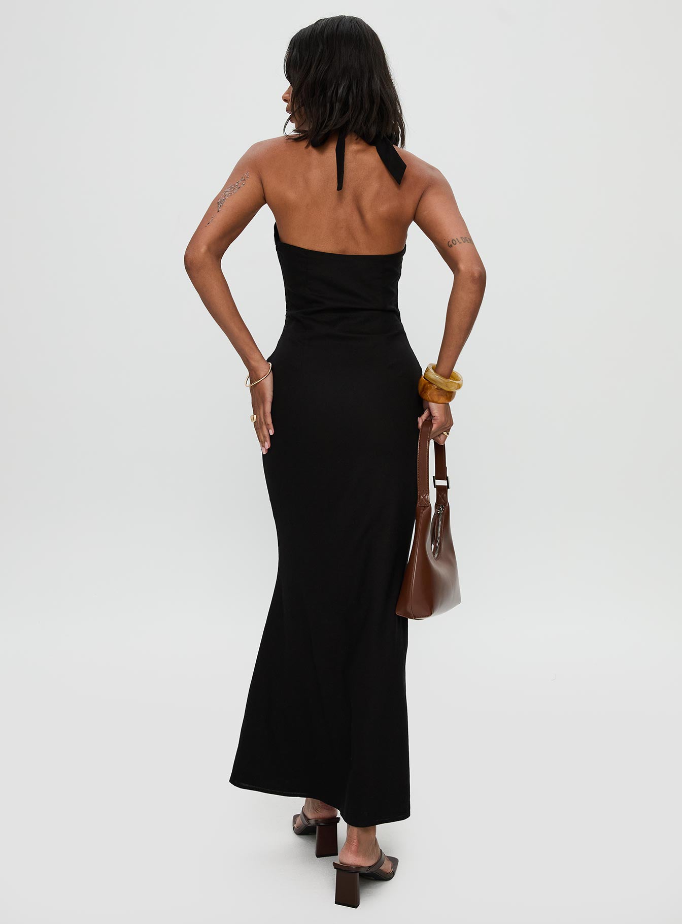 back view of model wearing Princess Polly Rapture Halter Maxi Dress Black Plunger 