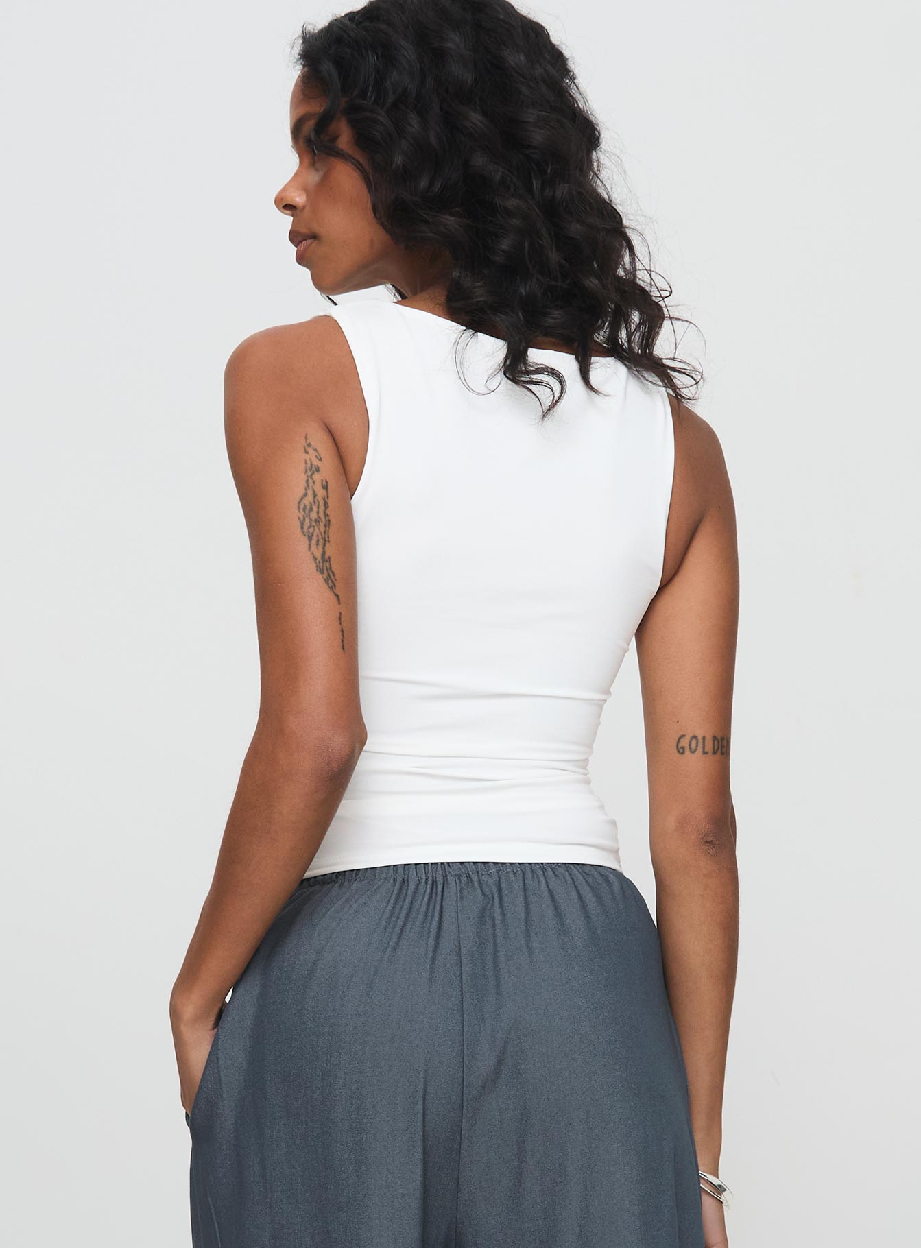 back view of model wearing Princess Polly Solani Top White Sleeveless High Neck 