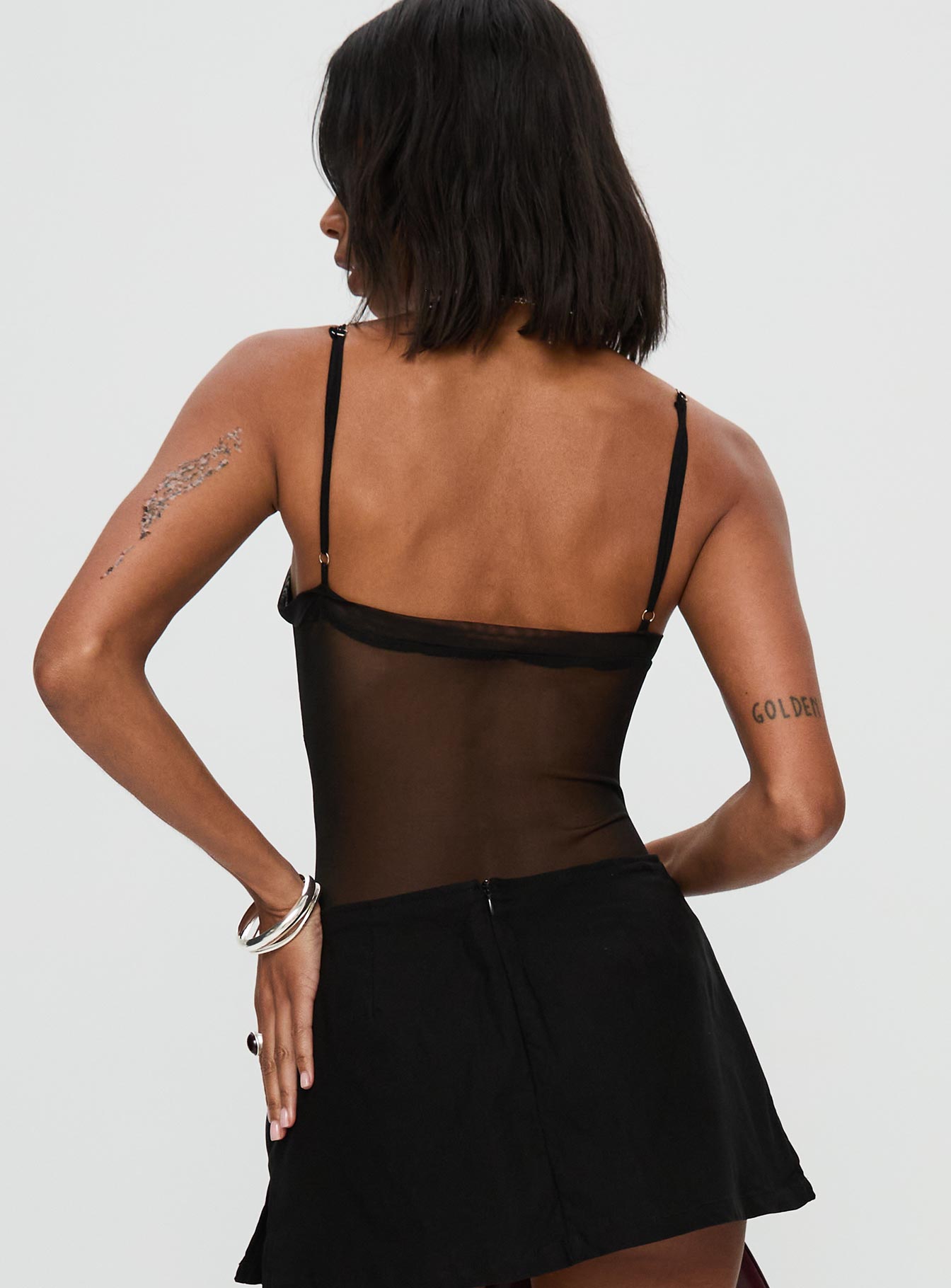 back view of model wearing Princess Polly In The Club Bodysuit Black Sleeveless 