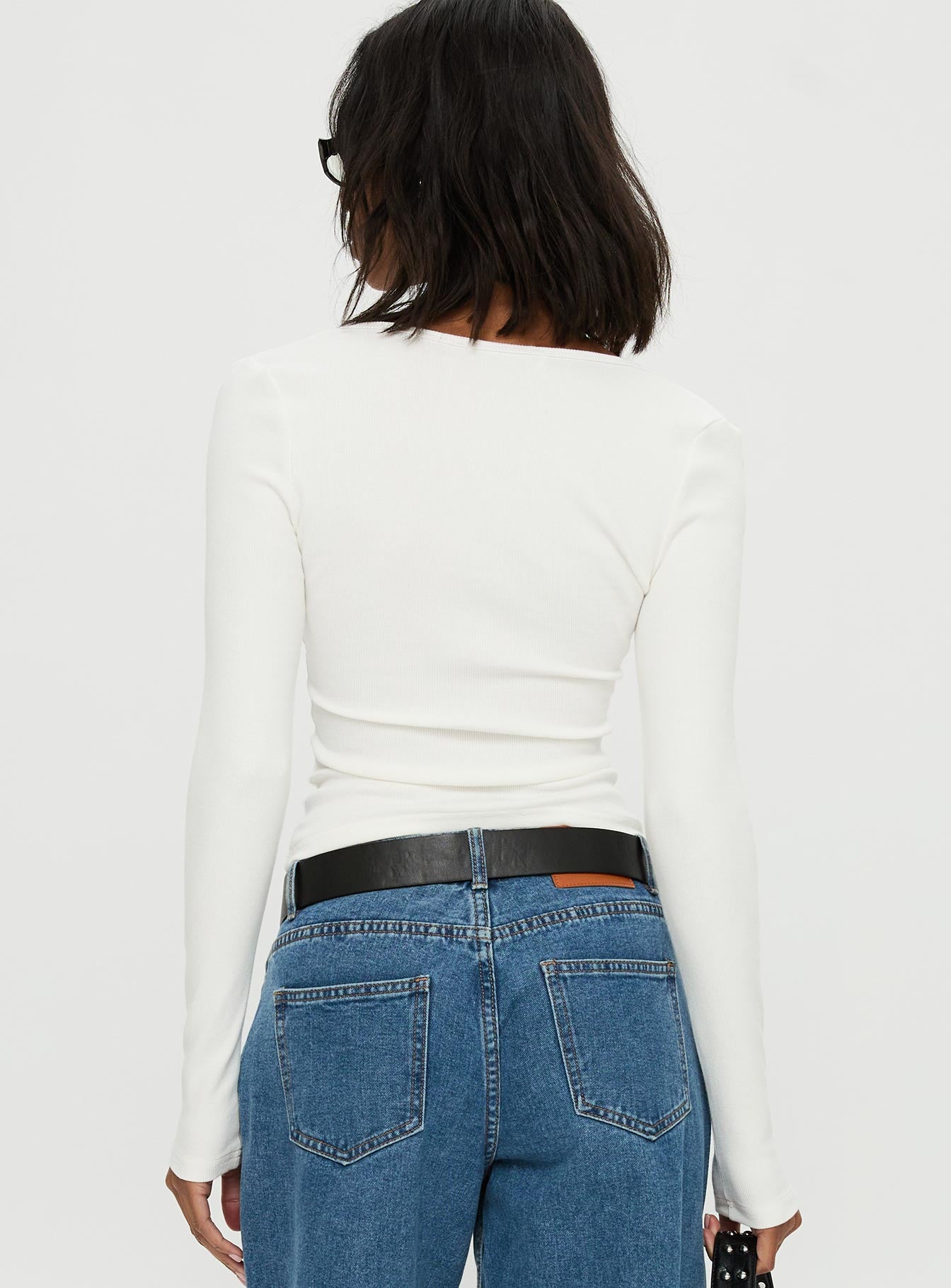 back view of model wearing Princess Polly Baseline Rib Long Sleeve Top White Full Sleeves Scoop Neck 