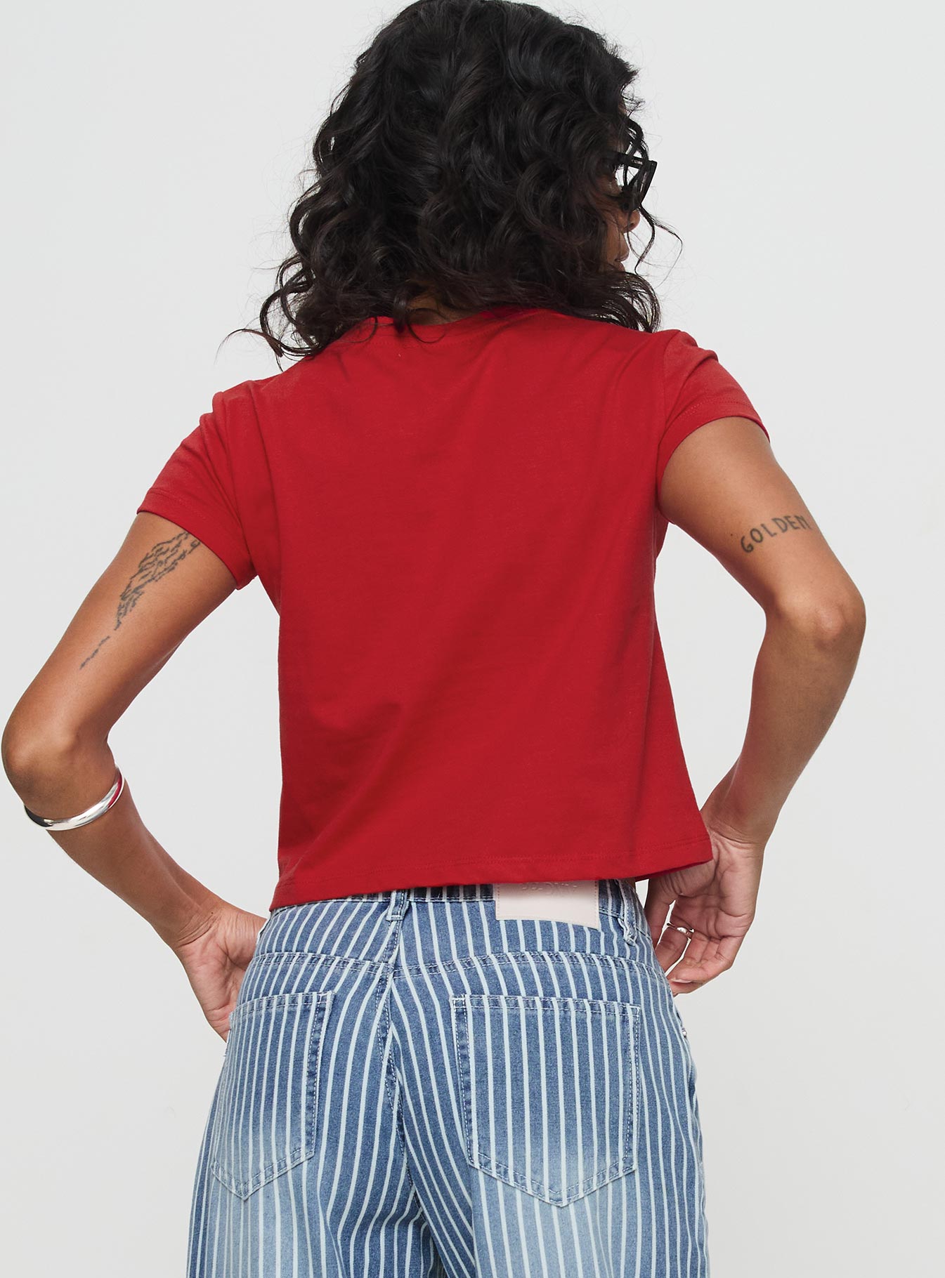 back view of model wearing Princess Polly Micah Tee Red Short Sleeves Crew Neck 