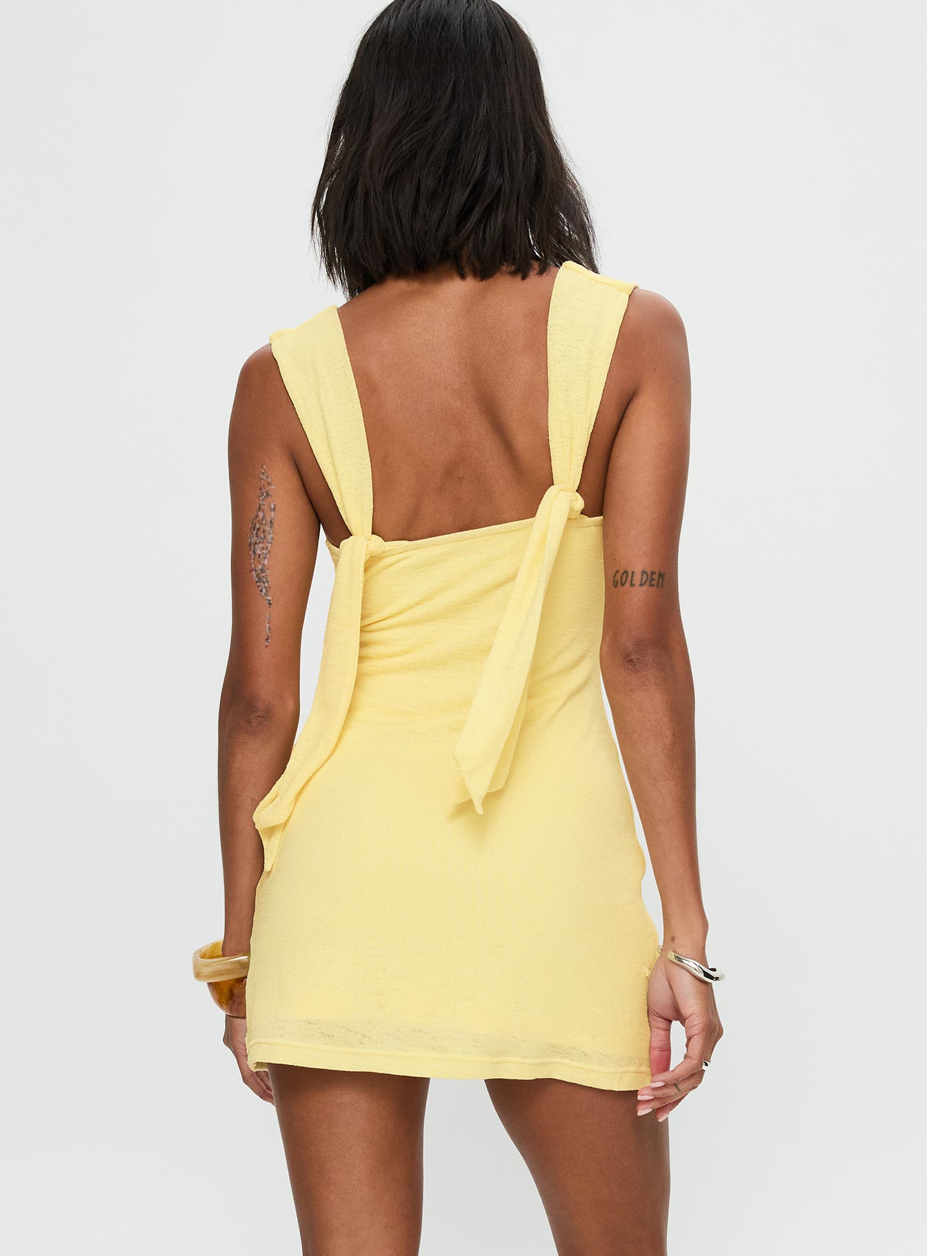 back view of model wearing Princess Polly Steward Mini Dress Lemon Plunger 
