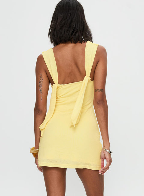 back view of model wearing Princess Polly Steward Mini Dress Lemon Plunger 