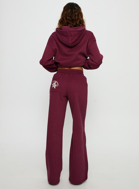 back view of model wearing Princess Polly Princess Polly Stargirl Wide Leg Sweat Pants Burgundy High Rise Pants 