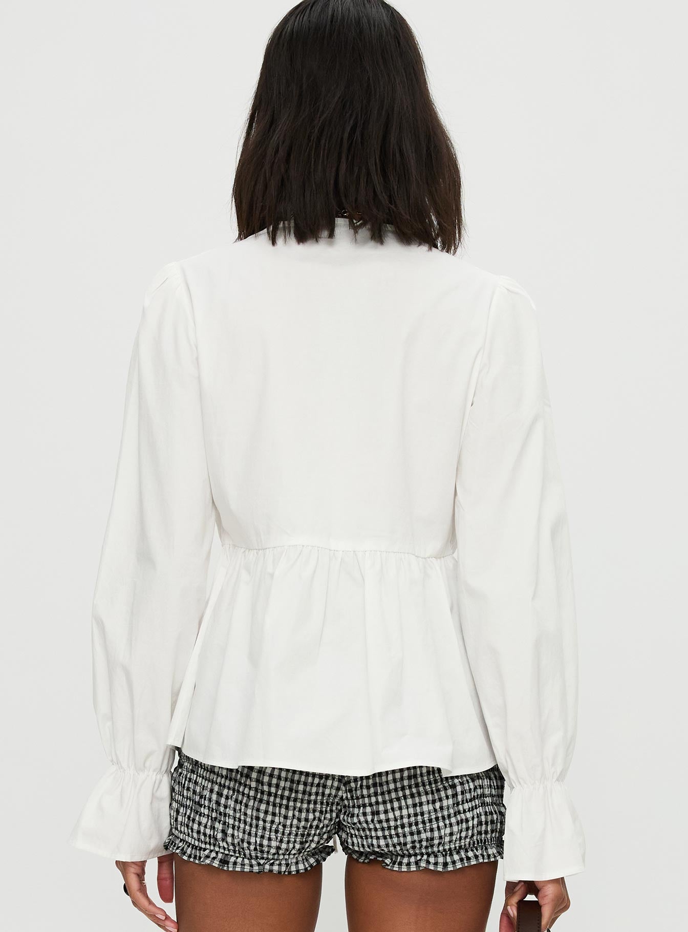 back view of model wearing Princess Polly Scarlotte Bow Tie Top White Full Sleeves V-Neck 