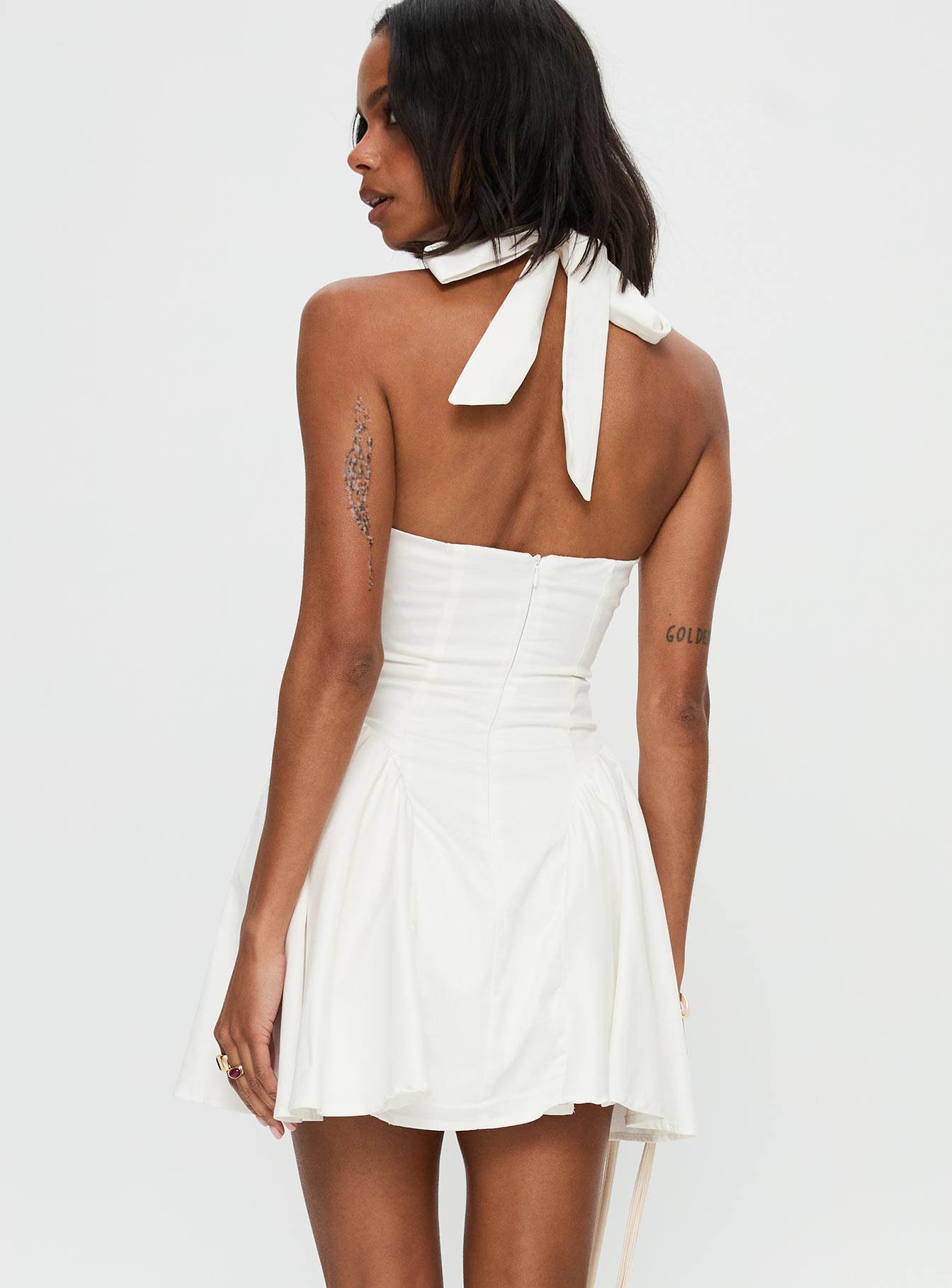 back view of model wearing Princess Polly Karisse Halter Mini Dress White Plunger 