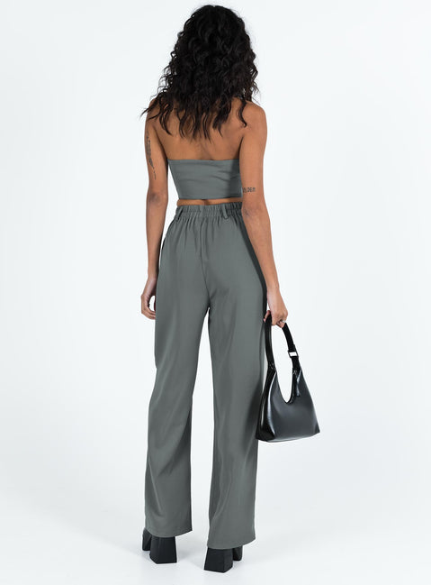 Matching set Vest top  Lapel collar  Button front fastening  High waisted pants  Zip and button fastening  Belt looped waist  Twin hip pockets  Elasticated back Wide leg 