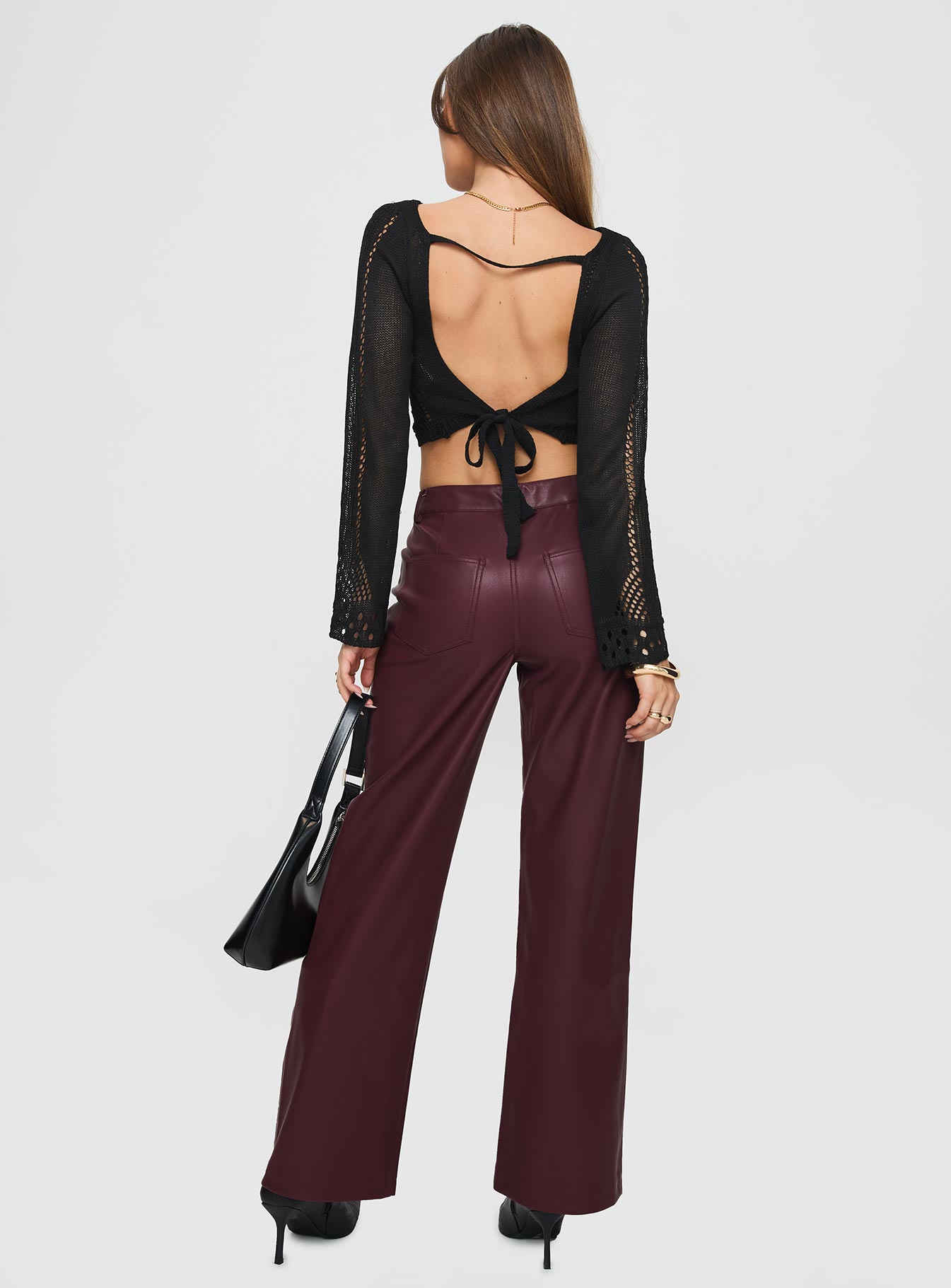 back view of model wearing Princess Polly Dempsey Faux Leather Pants Deep Cherry High Waisted Pants 
