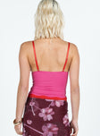 Slim fitting cami top, v-neckline Adjustable shoulder straps, lace trim at bust and hem