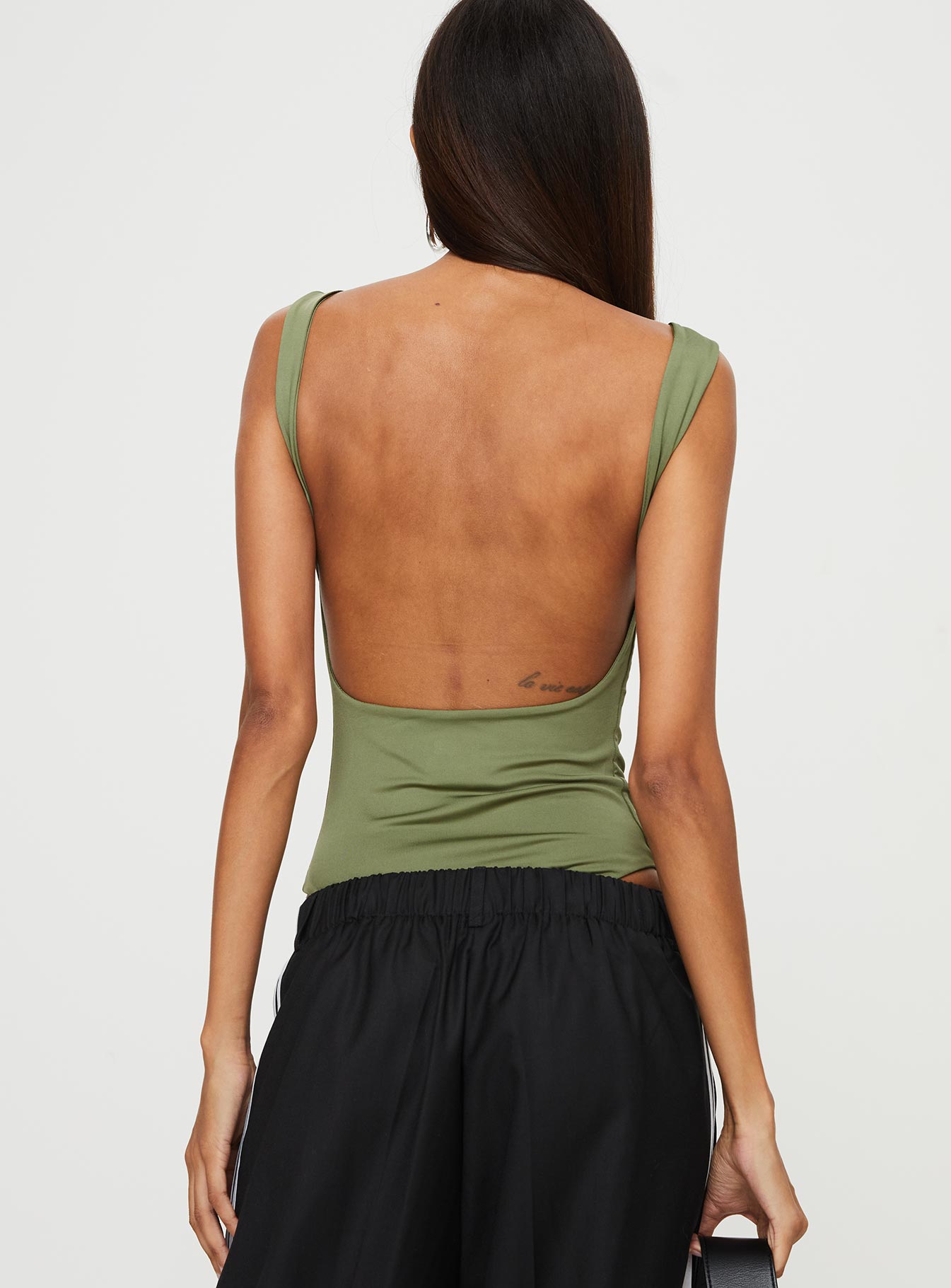 back view of model wearing Princess Polly Coomba Backless Bodysuit Green Sleeveless Boat Neck 