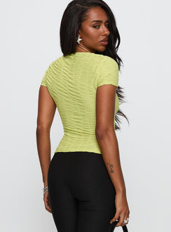 back view of model wearing Princess Polly Suzu Textured Top Green Short Sleeves Crew Neck 