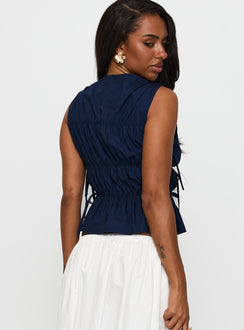 back view of model wearing Princess Polly Endless Summers Tie Side Top Navy Sleeveless High Neck 