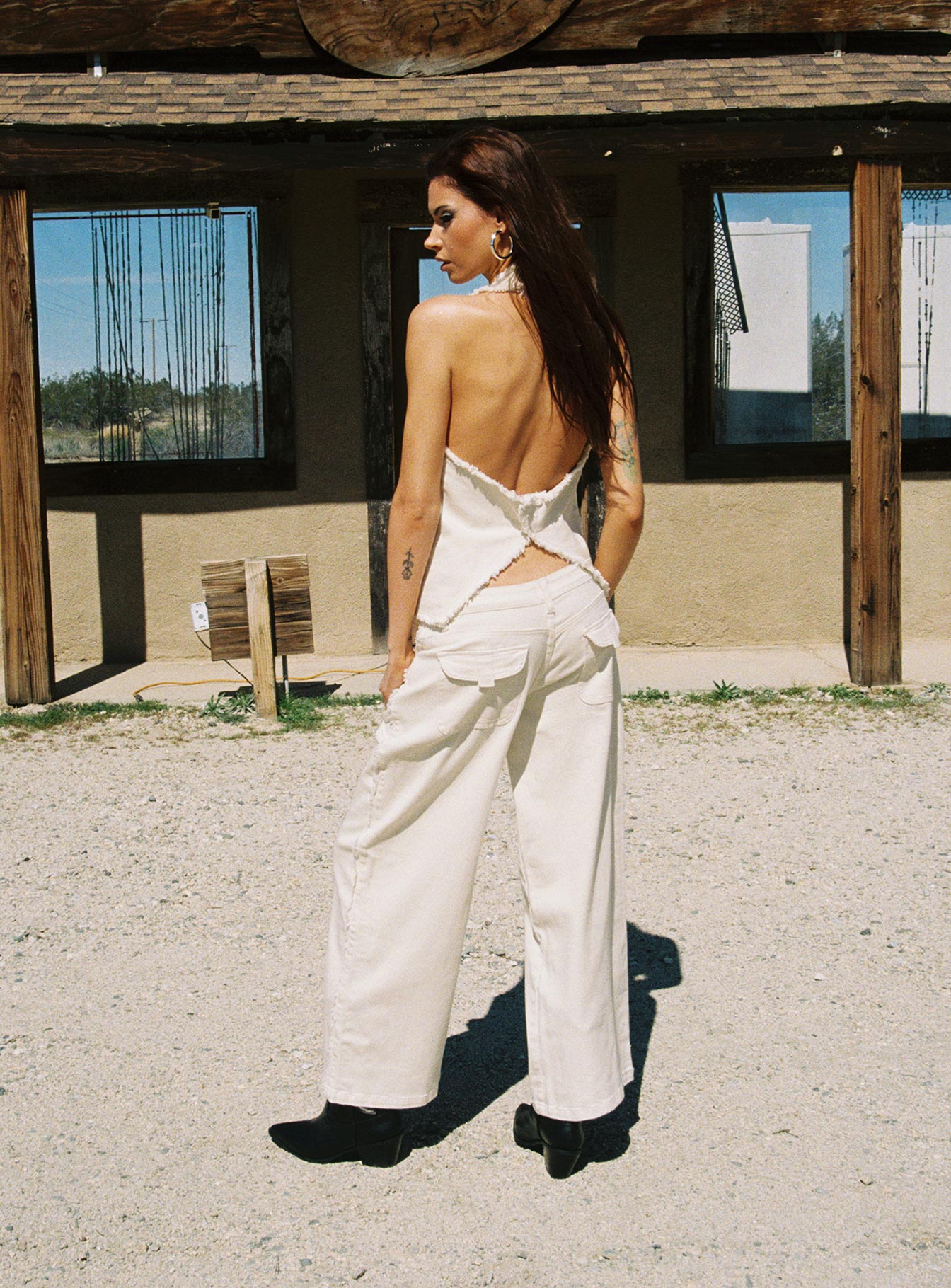 back view of model wearing Princess Polly Kiaan Low Rise Wide Leg Pants Cream Low Rise Pants 