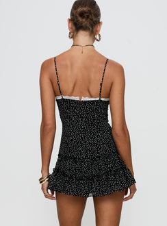 back view of model wearing Princess Polly Yves Mini Dress Onyx Polka Scoop Neck 