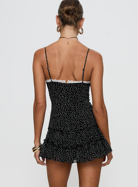 back view of model wearing Princess Polly Yves Mini Dress Onyx Polka Scoop Neck 
